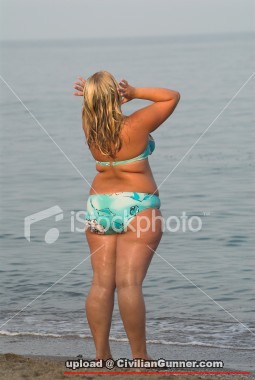 ist2_2061763-fat-woman-is-doing-morning-exercises-on-the-sea.jpg