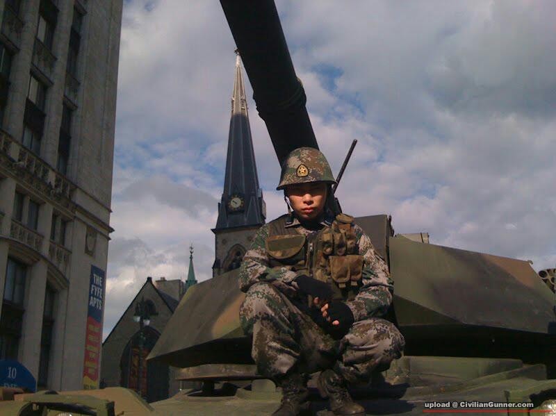 Chinese_Invader_in_front_of_tank_-_red_Dawn-1.jpg